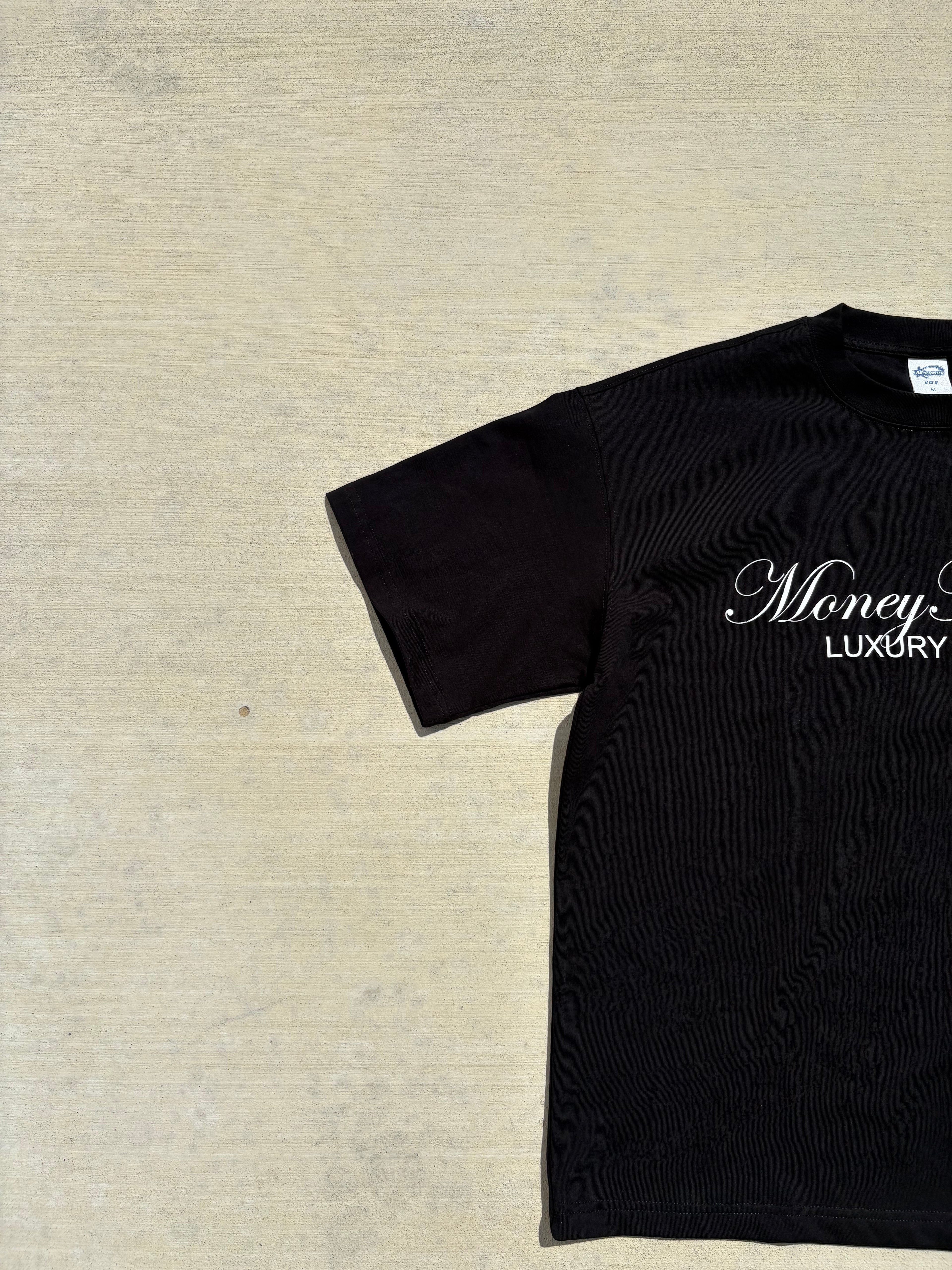 Champagne Stain Black Tee
